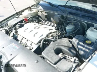 ✅ 1999 Cadillac Seville STS • VIN: 1G6KY5498XU941225 • Lot: 43040948. Listed on IAAI with 106,067 mi. Free auction sales archive from the USA and detailed vehicle history report at DreamBid. Image 12.