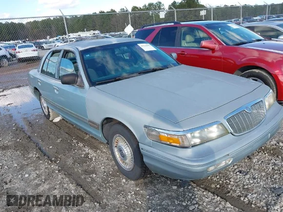 ✅ 1996 Mercury Grand Marquis GS • VIN: 2MELM74W7TX616694 • Лот: 41216582. Опубликован ранее на IAAI с пробегом 127 486 миль. Бесплатный доступ к архиву аукционных продаж из США и подробный отчёт об истории автомобиля на DreamBid. Изображение 1.