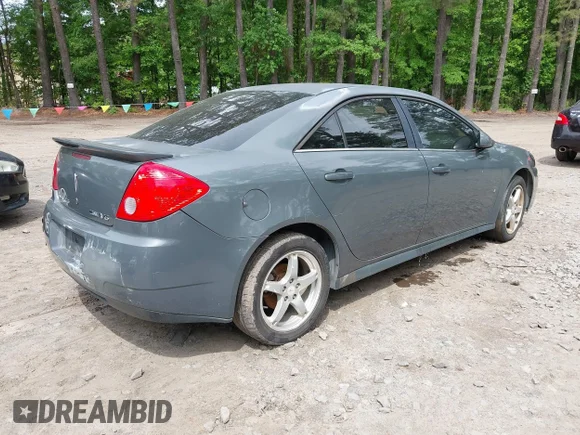 ✅ 2009 Pontiac G6 1SB • VIN: 1G2ZJ57K594257965 • Lot: 42224903. Wystawiony na IAAI z przebiegiem 233 990 mil. Bezpłatny archiwum sprzedaży aukcyjnych z USA i szczegółowy raport historii pojazdu na DreamBid. Zdjęcie 4.