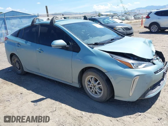 ✅ 2021 Toyota Prius LE • VIN: JTDL9MFU9M3023818 • Lot: 42842899. Listed on IAAI with 99,876 mi. Free auction sales archive from the USA and detailed vehicle history report at DreamBid. Image 1.