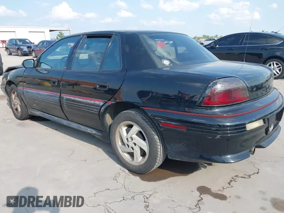 ✅ 1993 Pontiac Grand Am • VIN: 1G2NW54N4PC723449 • Lot: 43100930. Wystawiony na IAAI z przebiegiem 65 423 mil. Bezpłatny archiwum sprzedaży aukcyjnych z USA i szczegółowy raport historii pojazdu na DreamBid. Zdjęcie 3.