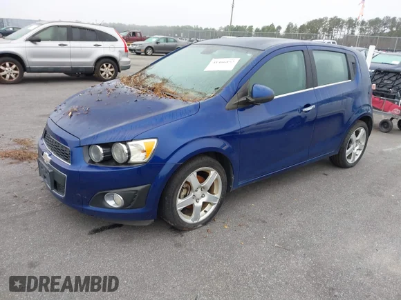 ✅ 2013 Chevrolet Sonic LTZ • VIN: 1G1JE6SB9D4230120 • Lot: 41466852. Wystawiony na IAAI z przebiegiem 83 953 mil. Bezpłatny archiwum sprzedaży aukcyjnych z USA i szczegółowy raport historii pojazdu na DreamBid. Zdjęcie 2.