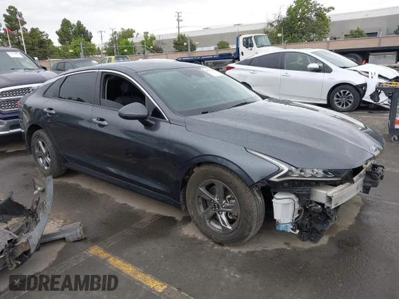 ✅ 2021 Kia K5 LXS • VIN: 5XXG14J23MG019665 • Лот: 44813289. Опубліковано раніше на IAAI з пробігом 95 322 миль. Безкоштовний доступ до архіву аукціонних продажів зі США та докладний звіт про історію автомобіля на DreamBid. Зображення 1.