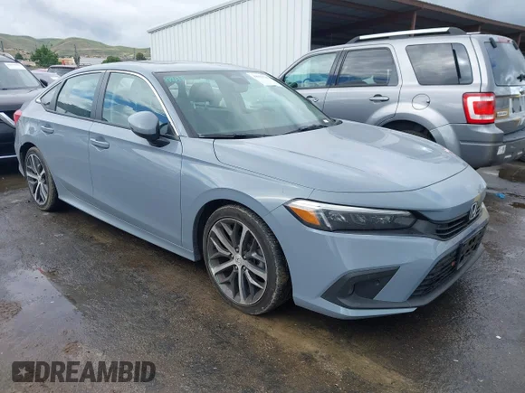 ✅ 2022 Honda Civic Touring • VIN: 2HGFE1F90NH316834 • Lot: 44922736. Listed on IAAI with 32,465 mi. Free auction sales archive from the USA and detailed vehicle history report at DreamBid. Image 1.