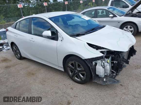 ✅ 2021 Toyota Prius L Eco • VIN: JTDKAMFU2M3139896 • Lot: 45268010. Listed on IAAI with 73,596 mi. Free auction sales archive from the USA and detailed vehicle history report at DreamBid. Image 1.