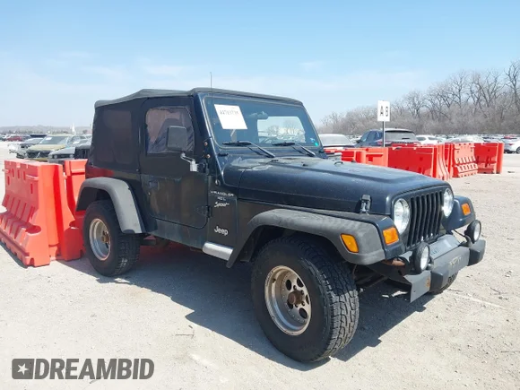 ✅ 2001 Jeep Wrangler Sport • VIN: 1J4FA49S51P344204 • Lot: 44713735. Listed on IAAI with 128,357 mi. Free auction sales archive from the USA and detailed vehicle history report at DreamBid. Image 1.
