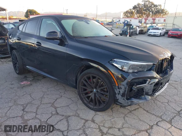 ✅ 2022 BMW X6 xDrive40i • VIN: 5UXCY6C02N9K41922 • Lot: 44092188. Listed on IAAI with 34,737 mi. Free auction sales archive from the USA and detailed vehicle history report at DreamBid. Image 1.