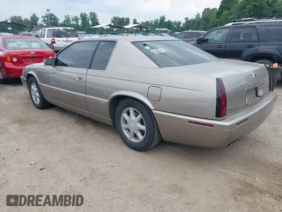 ✅ 2002 Cadillac Eldorado Touring • VIN: 1G6ET12932B100943 • Лот: 45459389. Опубликован ранее на IAAI с пробегом 75 265 миль. Бесплатный доступ к архиву аукционных продаж из США и подробный отчёт об истории автомобиля на DreamBid. Изображение 3.
