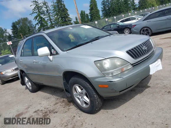 ✅ 1999 Lexus RX 300 • VIN: JT6HF10U5X0077328 • Лот: 42429034. Опубліковано раніше на IAAI з пробігом 214 648 миль. Безкоштовний доступ до архіву аукціонних продажів зі США та докладний звіт про історію автомобіля на DreamBid. Зображення 1.