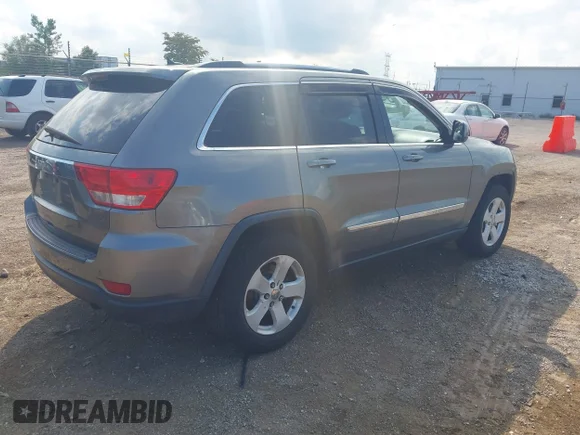 ✅ 2013 Jeep Grand Cherokee Laredo Altitude • VIN: 1C4RJFAG6DC537334 • Lot: 43214907. Listed on IAAI with 265,721 mi. Free auction sales archive from the USA and detailed vehicle history report at DreamBid. Image 4.