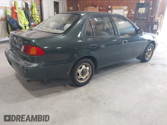 ✅ 2000 Toyota Corolla CE • VIN: 2T1BR12E6YC279890 • Лот: 45213966. Опубліковано раніше на IAAI з пробігом 98 628 миль. Безкоштовний доступ до архіву аукціонних продажів зі США та докладний звіт про історію автомобіля на DreamBid. Зображення 4.
