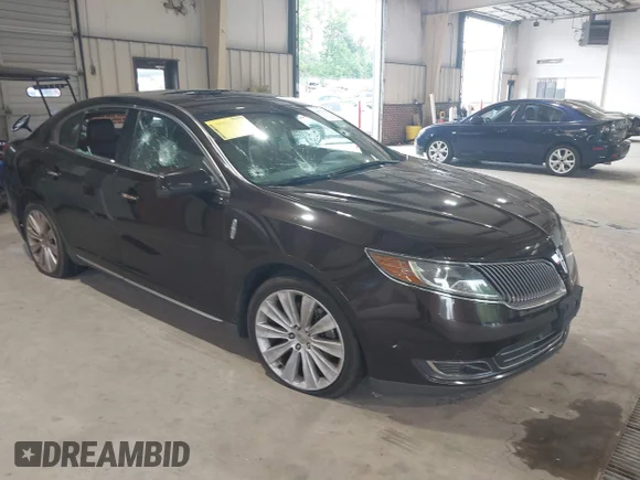 ✅ 2014 Lincoln MKS EcoBoost • VIN: 1LNHL9FT1EG608250 • Lot: 42579875. Listed on IAAI with 150,395 mi. Free auction sales archive from the USA and detailed vehicle history report at DreamBid. Image 1.