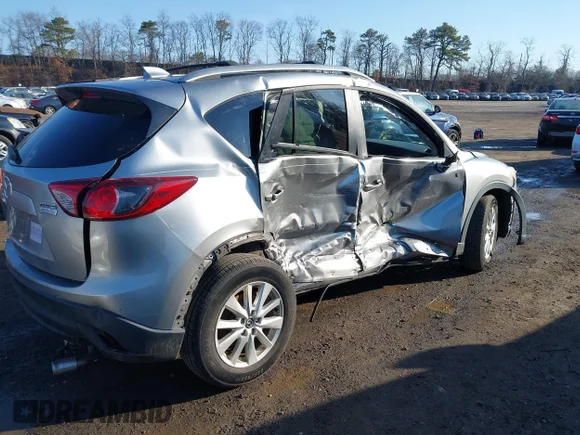 ✅ 2014 Mazda CX-5 Touring • VIN: JM3KE2CY4E0310979 • Lot: 44526196. Listed on IAAI with 141,812 mi. Free auction sales archive from the USA and detailed vehicle history report at DreamBid. Image 4.