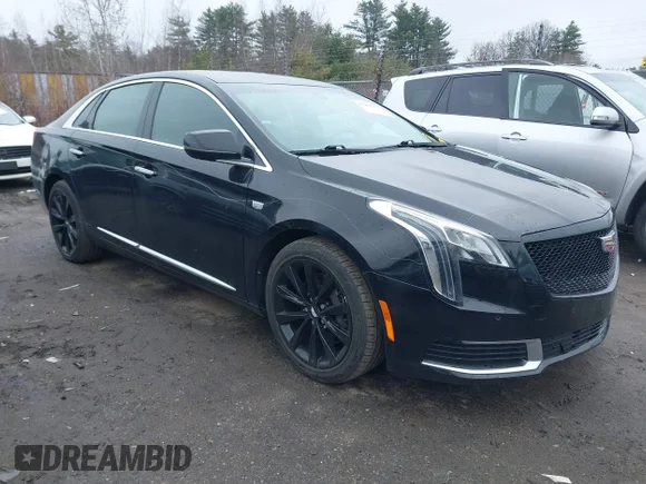 ✅ 2018 Cadillac XTS Livery • VIN: 2G61U5S3XJ9126003 • Лот: 41988271. Опубликован ранее на IAAI с пробегом 113 872 миль. Бесплатный доступ к архиву аукционных продаж из США и подробный отчёт об истории автомобиля на DreamBid. Изображение 1.