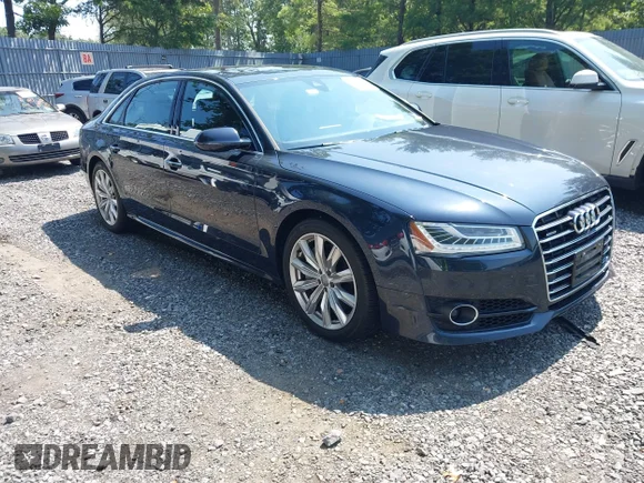 ✅ 2016 Audi A8 Sport • VIN: WAU43AFD1GN008644 • Lot: 42998536. Listed on IAAI with 119,521 mi. Free auction sales archive from the USA and detailed vehicle history report at DreamBid. Image 1.