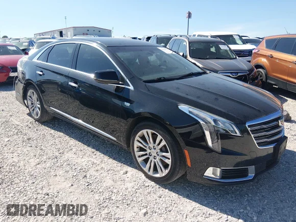 ✅ 2018 Cadillac XTS Luxury • VIN: 2G61M5S38J9118580 • Lot: 44380165. Listed on IAAI with 163,030 mi. Free auction sales archive from the USA and detailed vehicle history report at DreamBid. Image 1.