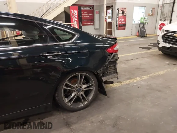 ✅ 2014 Ford Fusion Titanium • VIN: 3FA6P0D92ER172249 • Лот: 43905394. Опубликован ранее на IAAI с пробегом 71 870 миль. Бесплатный доступ к архиву аукционных продаж из США и подробный отчёт об истории автомобиля на DreamBid. Изображение 6.