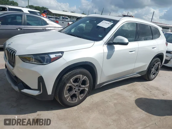 ✅ 2025 BMW X1 xDrive28i • VIN: WBX73EF02S5103536 • Лот: 42714287. Опубликован ранее на IAAI с пробегом 24 906 миль. Бесплатный доступ к архиву аукционных продаж из США и подробный отчёт об истории автомобиля на DreamBid. Изображение 2.