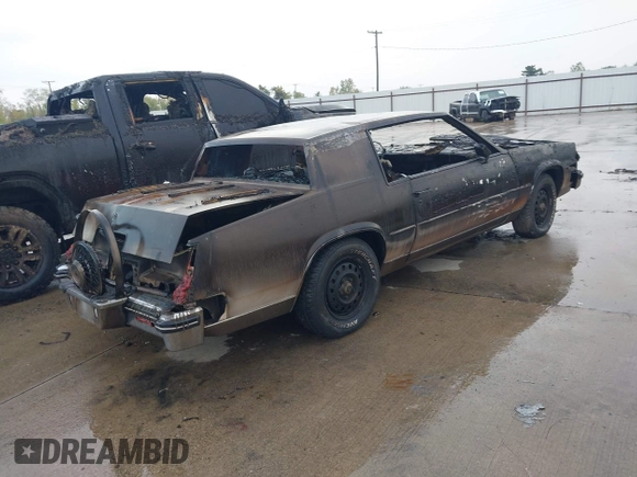 ✅ 1985 Cadillac Eldorado • VIN: 1G6EL5789FE668898 • Lot: 43064783. Listed on IAAI with 65,000 mi. Free auction sales archive from the USA and detailed vehicle history report at DreamBid. Image 4.