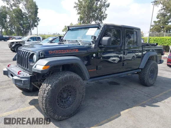 ✅ 2020 Jeep Gladiator Sport S • VIN: 1C6HJTAG6LL197344 • Lot: 43185992. Wystawiony na IAAI z przebiegiem 79 129 mil. Bezpłatny archiwum sprzedaży aukcyjnych z USA i szczegółowy raport historii pojazdu na DreamBid. Zdjęcie 2.