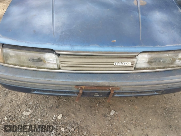 ✅ 1990 Mazda 626 • VIN: JM1GD2220L1812877 • Лот: 45309494. Опубликован ранее на IAAI с пробегом 126 962 миль. Бесплатный доступ к архиву аукционных продаж из США и подробный отчёт об истории автомобиля на DreamBid. Изображение 6.