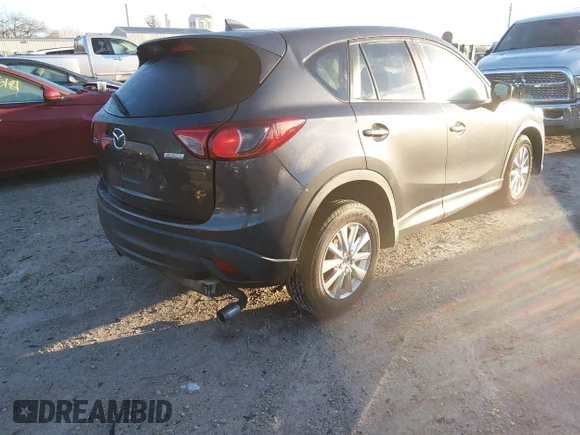 ✅ 2016 Mazda CX-5 Touring • VIN: JM3KE2CY0G0605208 • Lot: 44554945. Listed on IAAI with 164,156 mi. Free auction sales archive from the USA and detailed vehicle history report at DreamBid. Image 4.