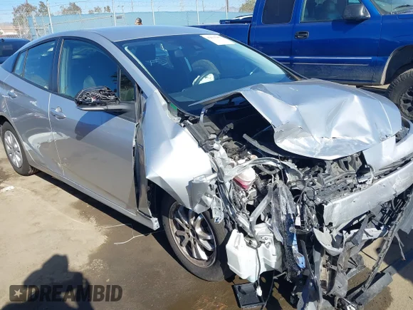 ✅ 2021 Toyota Prius L Eco • VIN: JTDKAMFU1M3152056 • Lot: 43657997. Listed on IAAI with 83,328 mi. Free auction sales archive from the USA and detailed vehicle history report at DreamBid. Image 1.