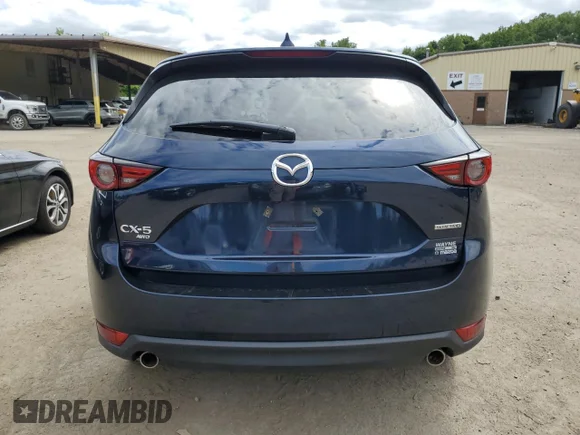 ✅ 2021 Mazda CX-5 Grand Touring • VIN: JM3KFBDM0M1374616 • Lot: 67982024. Wystawiony na Copart z przebiegiem Nie podano. Bezpłatny archiwum sprzedaży aukcyjnych z USA i szczegółowy raport historii pojazdu na DreamBid. Zdjęcie 6.