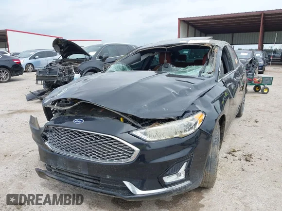 ✅ 2020 Ford Fusion Titanium • VIN: 3FA6P0K92LR192730 • Lot: 44882480. Listed on IAAI with 102,185 mi. Free auction sales archive from the USA and detailed vehicle history report at DreamBid. Image 2.