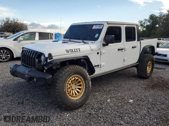 ✅ 2022 Jeep Gladiator Willys Sport • VIN: 1C6HJTAG3NL108428 • Lot: 71011005. Listed on Copart with 55,054 mi. Free auction sales archive from the USA and detailed vehicle history report at DreamBid. Image 1.