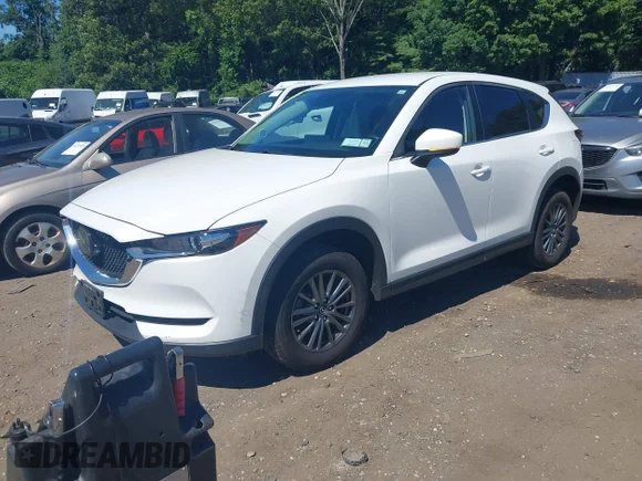 ✅ 2021 Mazda CX-5 Touring • VIN: JM3KFBCM3M0444052 • Lot: 45352670. Wystawiony na IAAI z przebiegiem 41 010 mil. Bezpłatny archiwum sprzedaży aukcyjnych z USA i szczegółowy raport historii pojazdu na DreamBid. Zdjęcie 2.
