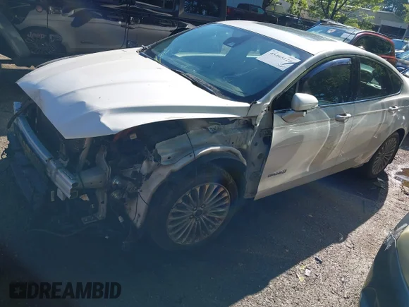 ✅ 2014 Ford Fusion Titanium Hybrid • VIN: 3FA6P0RU1ER351010 • Lot: 45465120. Listed on IAAI with 45,000 mi. Free auction sales archive from the USA and detailed vehicle history report at DreamBid. Image 2.