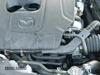 ✅ 2025 Mazda CX-50 S Premium • VIN: 7MMVABDMXSN381566 • Lot: 43696618. Listed on IAAI with 7,095 mi. Free auction sales archive from the USA and detailed vehicle history report at DreamBid. Image 24.