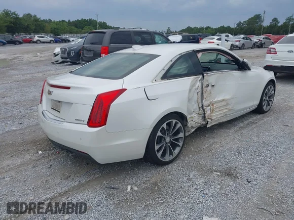 ✅ 2015 Cadillac ATS Premium RWD • VIN: 1G6AE1RX4F0128118 • Лот: 42211714. Опубліковано раніше на IAAI з пробігом 27 081 миль. Безкоштовний доступ до архіву аукціонних продажів зі США та докладний звіт про історію автомобіля на DreamBid. Зображення 4.