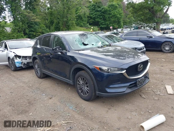 ✅ 2019 Mazda CX-5 Touring • VIN: JM3KFBCM2K0601776 • Lot: 45321200. Listed on IAAI with 52,553 mi. Free auction sales archive from the USA and detailed vehicle history report at DreamBid. Image 1.
