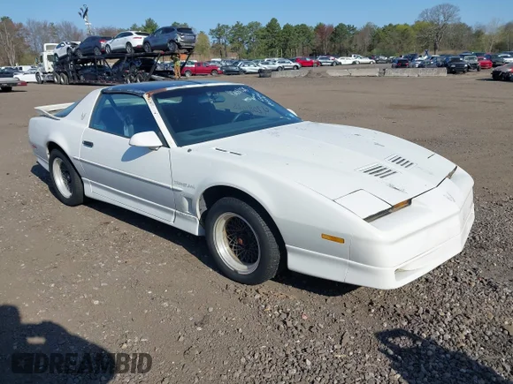 ✅ 1990 Pontiac Firebird • VIN: 1G2FW23F9LL206767 • Lot: 42081028. Listed on IAAI with 64,836 mi. Free auction sales archive from the USA and detailed vehicle history report at DreamBid. Image 1.