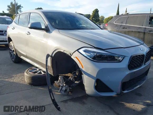 ✅ 2022 BMW X2 sDrive28i • VIN: WBXYH9C05N5U54883 • Lot: 44159781. Listed on IAAI with 37,134 mi. Free auction sales archive from the USA and detailed vehicle history report at DreamBid. Image 1.