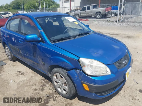 ✅ 2009 Kia Rio LX • VIN: KNADE223196491658 • Лот: 45093031. Опубликован ранее на IAAI с пробегом 93 337 миль. Бесплатный доступ к архиву аукционных продаж из США и подробный отчёт об истории автомобиля на DreamBid. Изображение 1.