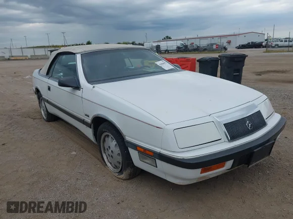 ✅ 1988 Chrysler LeBaron • VIN: 1C3BJ55E8JG306772 • Lot: 44815984. Listed on IAAI with 59,306 mi. Free auction sales archive from the USA and detailed vehicle history report at DreamBid. Image 1.